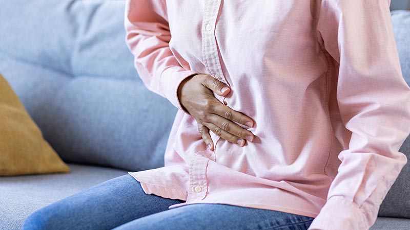 woman holding stomach