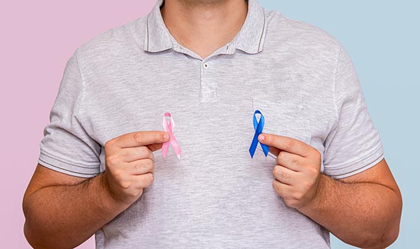 man with pink and blue ribbons