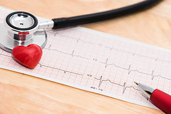 A stethoscope on top of a notepad