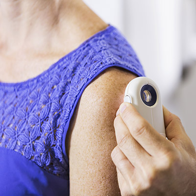 Examination of female patient's shoulder